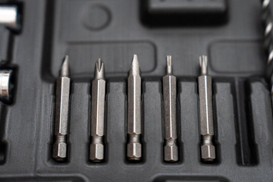 Metal screwdriver bits organized in tool case