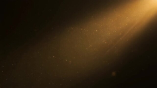 Cinematic close-up of tiny dust particles floating slowly through warm diagonal sunbeam