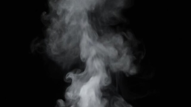 Close-up of delicate white steam slowly rising and curling against black background for compositing overlay