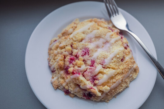 Berry crumb coffee cake or streusel cake topped with white sugar glaze