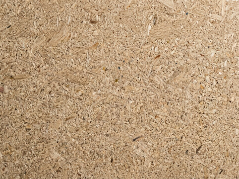 Close up of particleboard texture. Pressed wood chip panel background