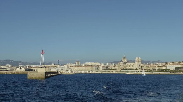Scenic view of Marseille's coastline with the Cathedrale La Major seen from a moving boat