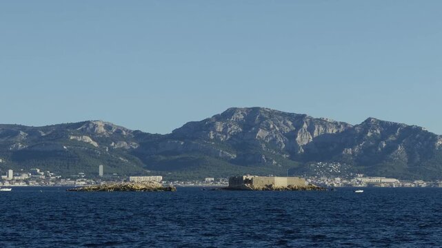 Stunning view of the Marseille coastline and mountains seen from a moving boat on the Mediterranean Sea