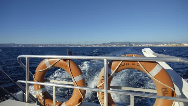 Scenic view of the wake of a boat sailing away from the city of Marseille in the Mediterranean Sea
