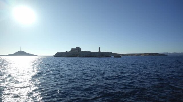 Sailing on the Mediterranean Sea with a view of the famous Chateau d'If fortress near Marseille