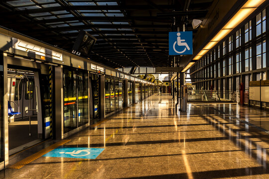 Golden hour sunlight reflecting on the polished floor of Morumbi Station on the new Line 17-Gold monorail transit system. 