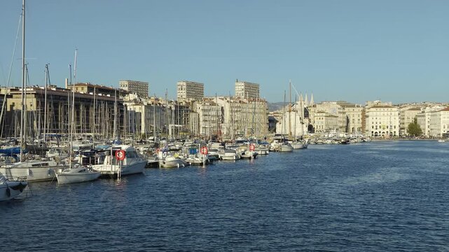 Sunny view of the old port of Marseille with yachts and sailboats moored at the dock