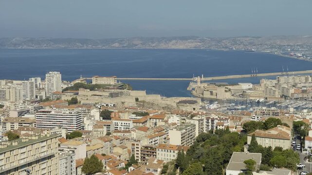Panoramic aerial view of the city of Marseille in France, featuring the Old Port and the sea
