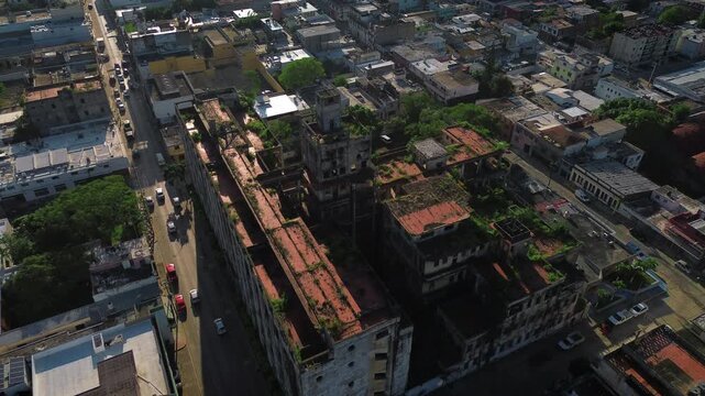 Abandoned Old Civil Hospital Tampico aerial view at sunrise overgrown plants vegetation old architecture historic downtown surrounding streets empty traffic drone shot Tamaulipas Mexico decay monument