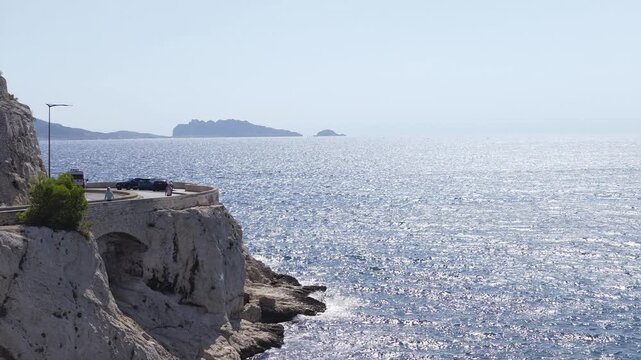 Beautiful panoramic view of the sparkling Mediterranean Sea from a coastal road in Marseille, France
