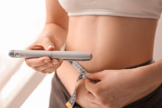 Diabetes management and weight loss, woman using insulin pen and measuring waist with tape for health monitoring and metabolic wellness in daily routine