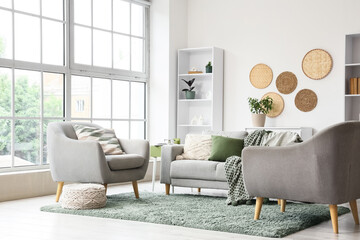 Interior design and home comfort, modern living room with grey sofa and armchair, cozy apartment decor with natural light and minimalist furniture © Pixel-Shot