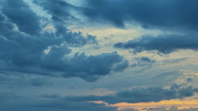 Dramatic blue and gray clouds moving across the sky at sunset over Marseille, France