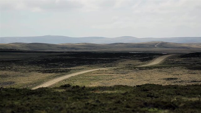 Cloud Shadows Moving Across Remote Dirt Road in Falkland Islands Landscape (Islas Malvinas) - 4K