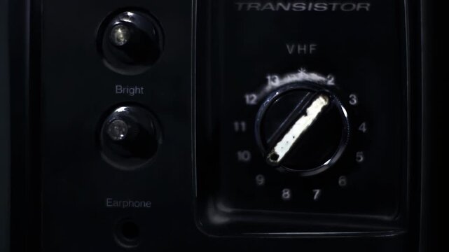 Hand Turning Rotary Channel Knob on Vintage Retro Television Set - 4K
