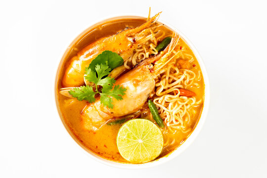 Instant noodles, Tom Yum Goong spicy shrimp soup in a white bowl isolate on white background.