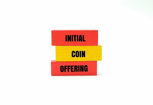 Colorful blocks with text "INITIAL COIN OFFERING". Cryptocurrency fundraising, blockchain investment and financial growth concepts