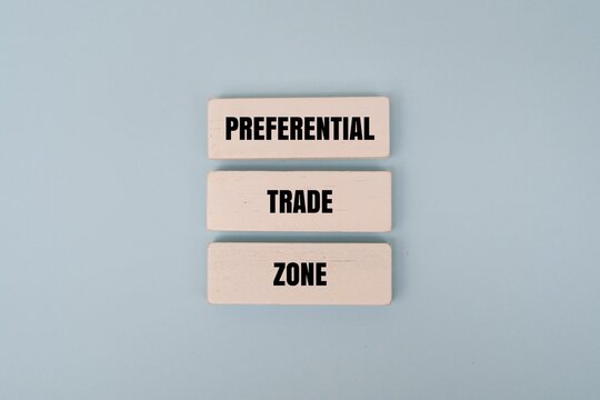 A white blocks with "PREFERENTIAL TRADE ZONE" text against coloured background. Representing global economics, international commerce, and trade agreements