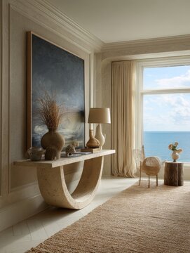Luxury coastal modern interior with travertine console table, large artwork, table lamp, coastal decor, raffia rug, soft daylight, and sea view.