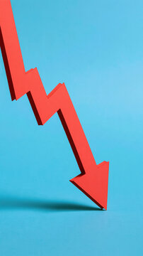 Red Arrow Downward Trend: A sharp red arrow curves downward against a vibrant blue background, symbolizing a decline, recession, or negative financial performance.
