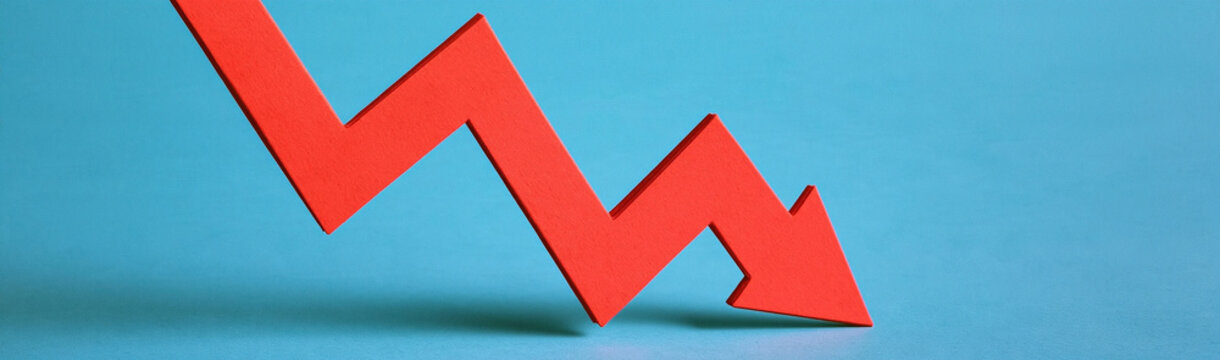 Red Arrow Downward Trend: A sharp red arrow points downwards, symbolizing a decline or negative trend against a striking blue background.