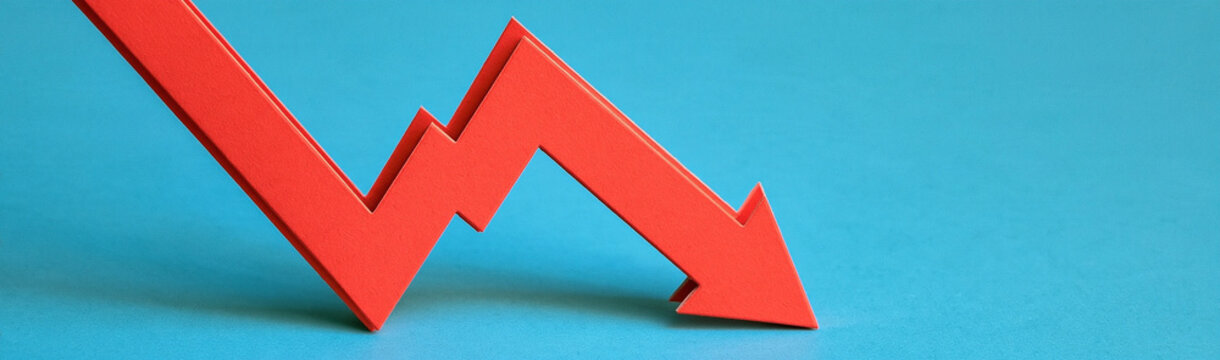 Red Arrow Down Trend: A sharp red arrow points downwards, symbolizing a downward trend, financial loss, or decline in stock market.