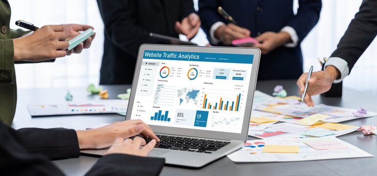 Analyst team use sticky note for creative and analytic brainstorm for business idea with BI data dashboard on laptop screen. Analysis financial data visualization tech for marketing strategy. Prodigy