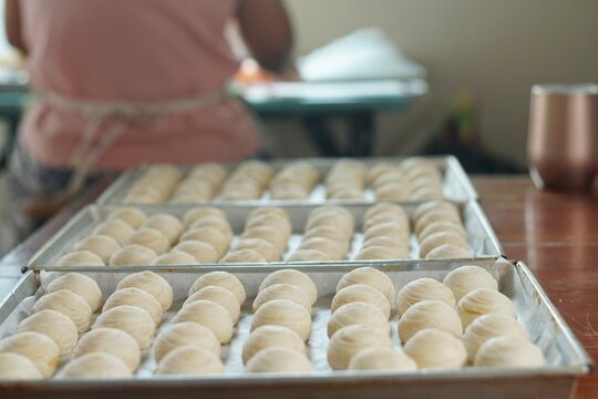 Toasted Mung Bean Cake from the oven. Chinese pastry or moon cake filled with sweet mung bean paste and salted egg yolk. Delicious pastry.