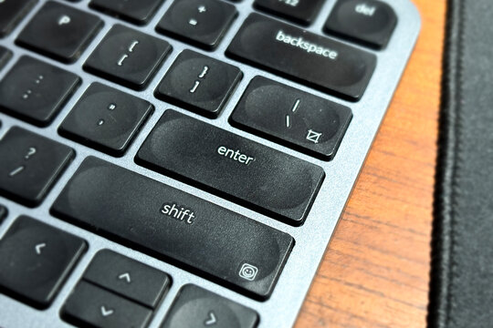 Close up of the enter key on a modern computer keyboard