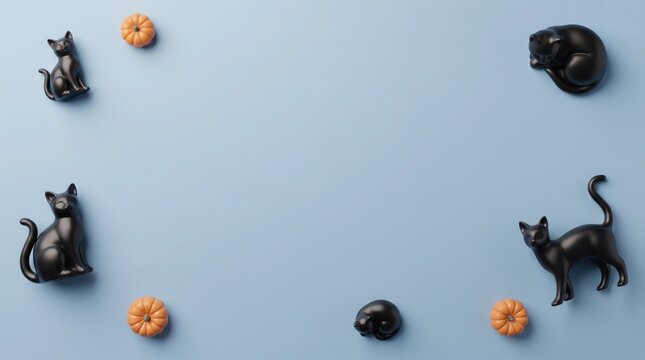 Black cat figurines and mini pumpkins on light background