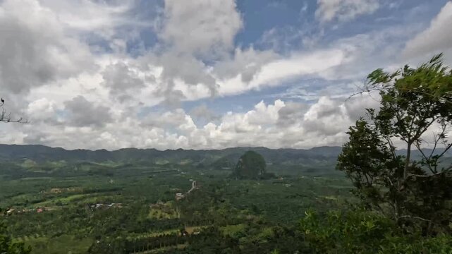 Panoramic view of Tianmen Mountain, Heaven's Gate, over lush green landscape in Chumphon, Thailand.
