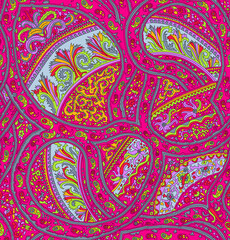 Seamless repeating pattern with paisley motifs placed at different angles, balanced by smaller floral elements and filler © Venkatsai