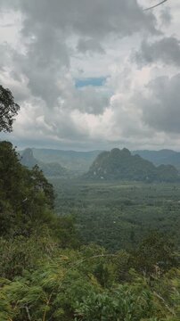 Dramatic landscape of Tianmen Mountain, Heaven's Gate, Chumphon, Thailand, featuring lush green forests.