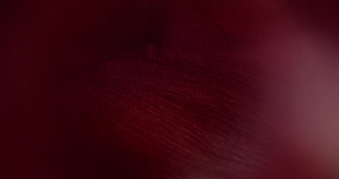 Red flow ink. Blur shimmer pigment. Glitter water purple color bright fluid shiny texture spill on abstract acrylic art background.