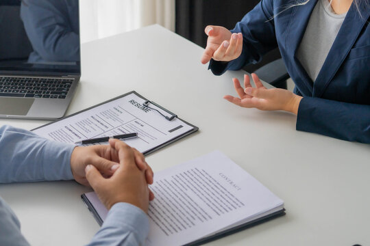 Asian businesswoman giving interview to human resource