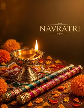 Traditional brass diya oil lamp and colorful dandiya sticks for navratri festival puja