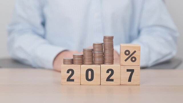 2027 New year with percentage change to UP and Down arrow with coin stack. Interest rate, GDP, stocks market, financial, deflation and Inflation, mortgage, debt, Loan and Economic Recession