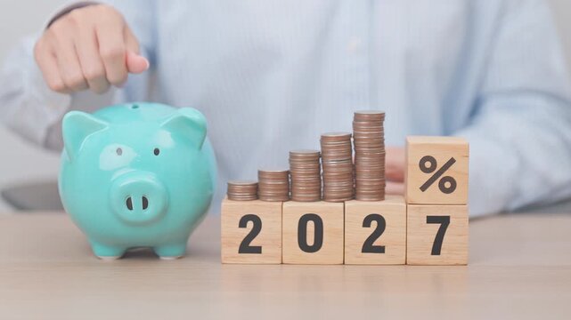 2027 New year with percentage change to UP and Down arrow with coin stack. Interest rate, GDP, stocks market, financial, deflation and Inflation, mortgage, debt, Loan and Economic Recession