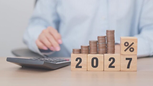2027 New year with percentage change to UP and Down arrow with coin stack. Interest rate, GDP, stocks market, financial, deflation and Inflation, mortgage, debt, Loan and Economic Recession