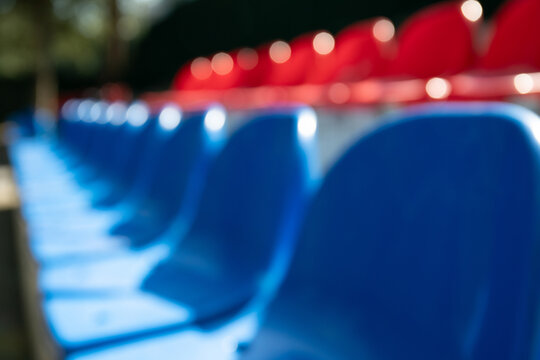 Rows of blue and red seats await enthusiastic fans at outdoor stadium