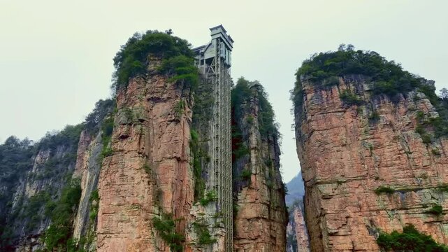 Bailong Elevator exterior view on giant sandstone pillar cliff in Zhangjiajie National Forest Park China