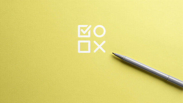 Pen pointing at survey check mark and cross symbols on yellow background with copy space
