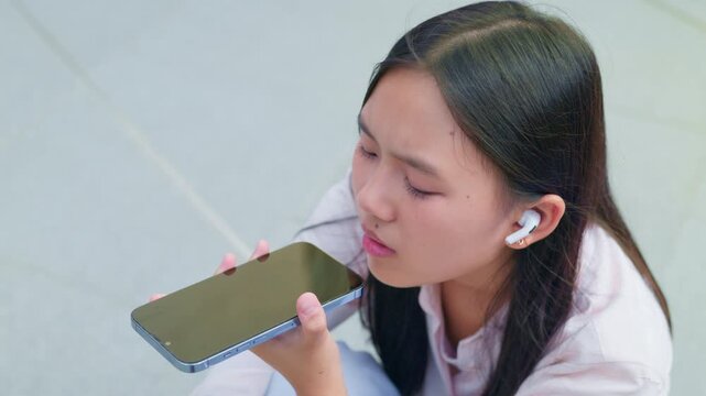 woman talking and command an AI voice assistant on a smartphone as a conceptual backdrop for artificial intelligence technology communication phone innovation virtual assistant and smart lifestyle