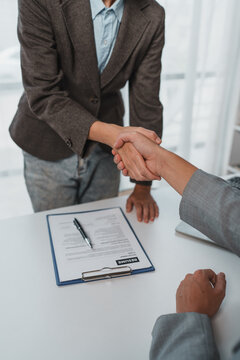 Business people shaking hands during job interview
