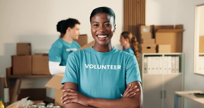 Woman, volunteer and face in NGO with arms crossed, charity preparation and outreach program. Coordinator, confident and happy at centre for food drive, social responsibility or donations for project