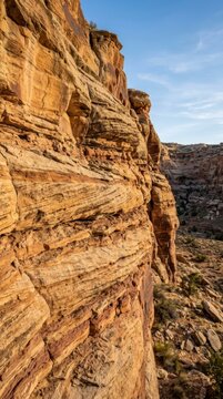 Majestic Layered Sandstone Cliff Face in a Natural Canyon Landscape