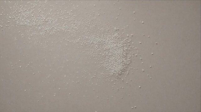 Minimal Gray Top View Water Droplet Texture Background, Abstract Surface with Soft Moisture Detail, Subtle Tonal Variation, Fine White Powder, Organic Pattern, Calm Design Visual
