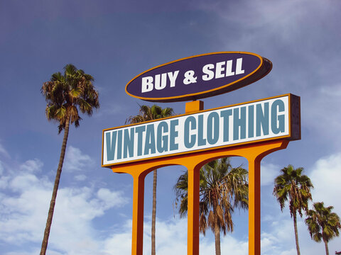 Aged and worn vintage clothing sign