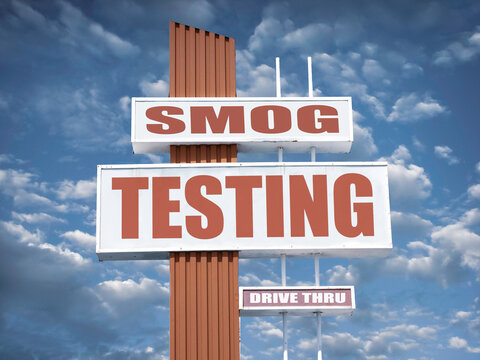 Aged and worn smog test sign