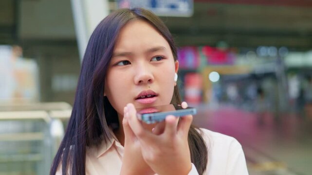 woman talking and command an AI voice assistant on a smartphone as a conceptual backdrop for artificial intelligence technology communication phone innovation virtual assistant and smart lifestyle